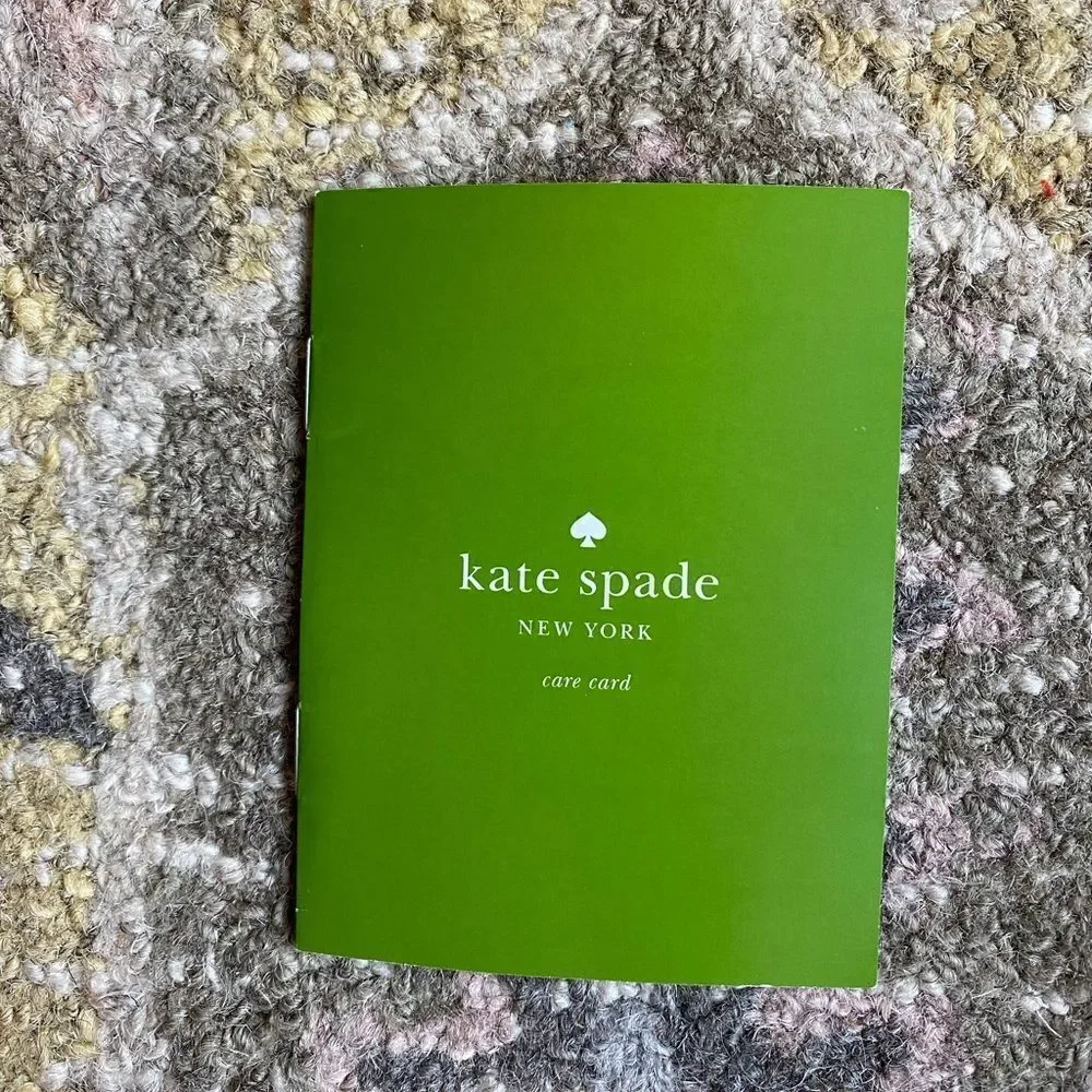 Kate  Spade  Purse with Bow color bag is Black and White